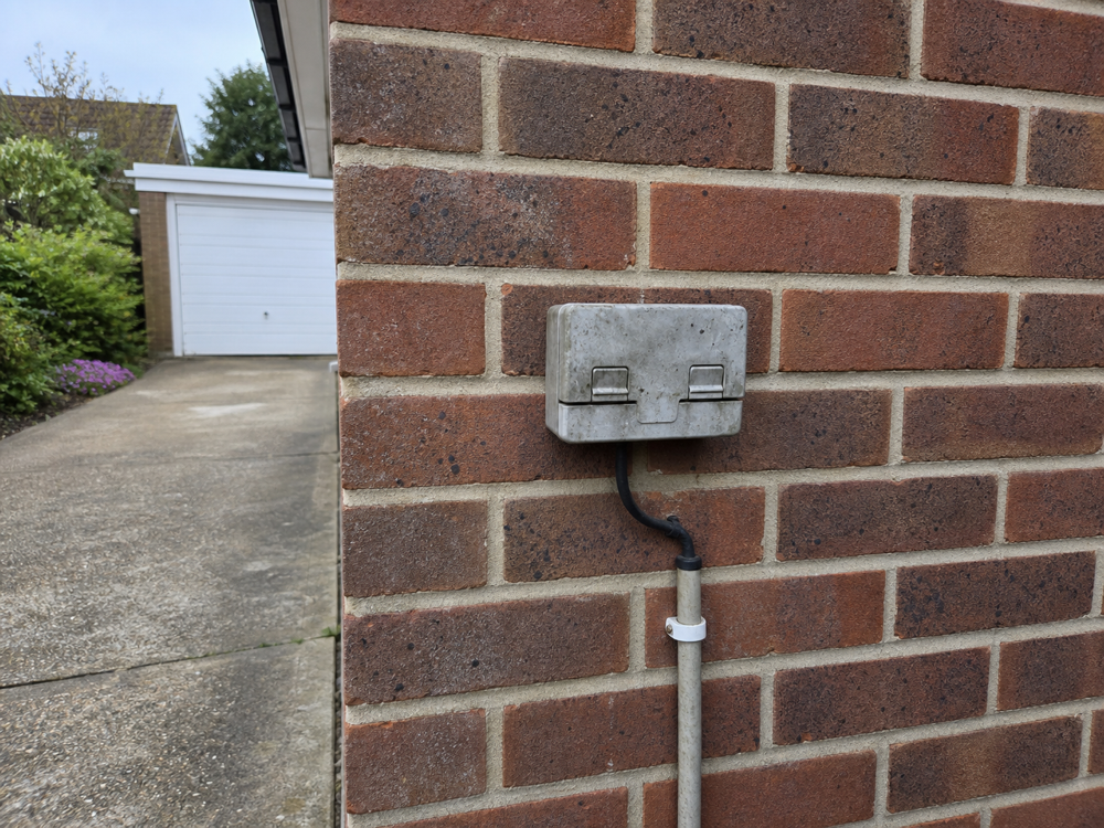 Before: Weathered outdoor socket to EV charge point, Greenwich